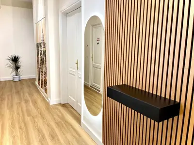 a dressing room with a mirror and a black bench at LH Vatican Museum Wi-Fi AC Flat Premium Comfort in Rome