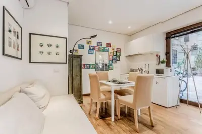 a kitchen and dining room with a table and chairs at Green Loft di Trastevere in Rome