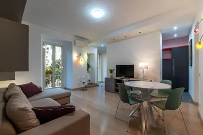 a living room with a couch and a table at Leone IV - WelcomeToRhome in Rome