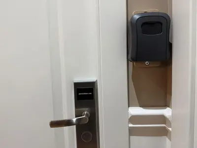 a door with a paper towel dispenser on it at Gloria Mundi in Rome
