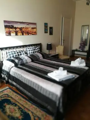 a bedroom with two beds in a room at The Pope's Room in Rome