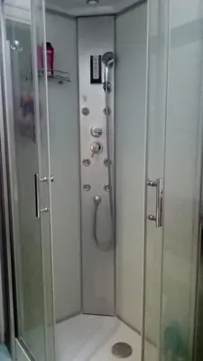 a shower in a bathroom with a glass door at The Pope's Room in Rome