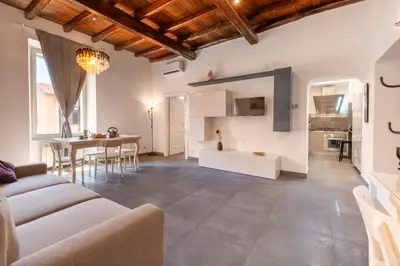 a living room with a couch and a table at Angelina Domus Saint Peter's in Rome