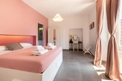 a bedroom with two beds with towels on them at Angelina Domus Saint Peter's in Rome