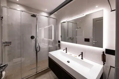 a white bathroom with a sink and a shower at Roma apartments in Rome