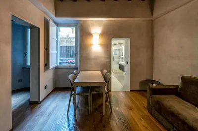 a living room with a table and a couch at Roma apartments in Rome
