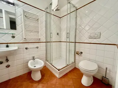 a bathroom with a shower and a toilet and a sink at Linda Charme in Rome