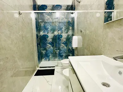 a bathroom with a shower and a toilet and a sink at Jupiter Home in Rome