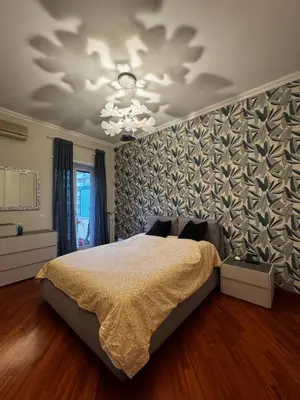 a bedroom with a bed and a wall at La casa di Gió in Rome