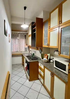 a kitchen with a sink and a stove top oven at San Giovanni Apartment in Rome