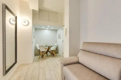 a living room with a couch and a table at Pica's House in Rome