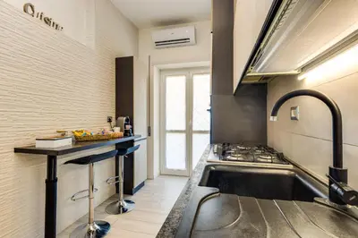 a kitchen with a sink and a stove at Pica's House in Rome