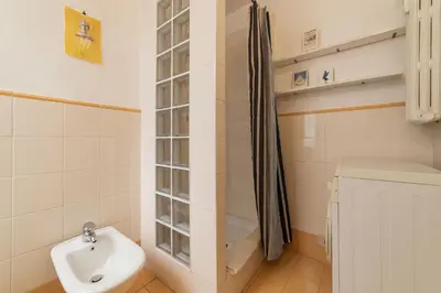 a bathroom with a toilet and a sink and a shower at Casa di Cosimo - WelcomeToRhome in Rome