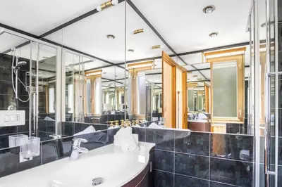 a bathroom with a sink and a large mirror at Boutique Caravaggio in Rome