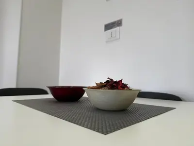 a bowl of food sitting on top of a table at Sunflower House in Rome