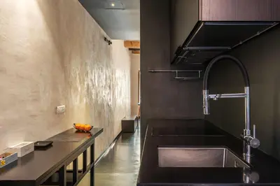 a kitchen with a sink and a counter at GuestHost - Vintage-Modern Apartment Trastevere in Rome
