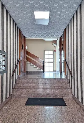 an empty hallway with stairs in a building at Appartamento via Caneva - Tiburtina in Rome