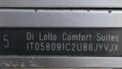 a sign on the side of a building at Di Lollo Comfort Suites in Rome