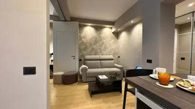 a living room with a couch and a table at CEMMA luxury apartment in Rome