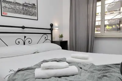 a bedroom with two beds with white towels on them at 4BNB - Otello in Rome