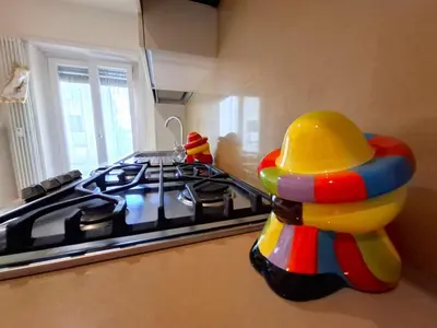 a toy duck sitting next to a stove in a kitchen at Sophìa, City Retreat near Vatican in Rome