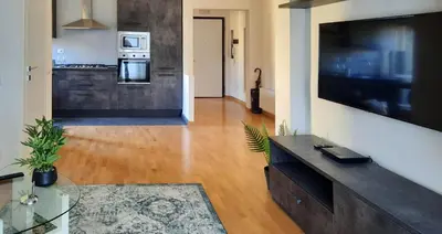 a living room with a large flat screen tv at Casa Maloia in Rome