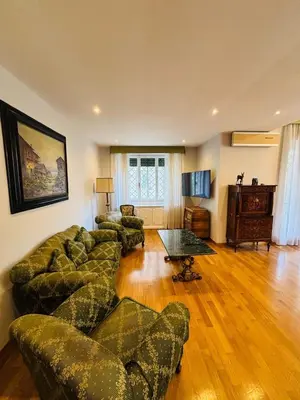 a living room with couches and a coffee table at Tiziano House by Ghor in Rome