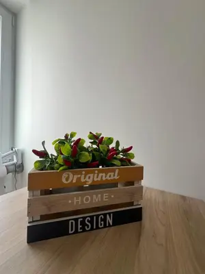 a wooden box with a sign that reads original home design at CAFE Balduina in Rome