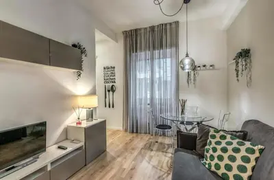 a living room with a couch and a table at FRAM Vatican Apartment in Rome