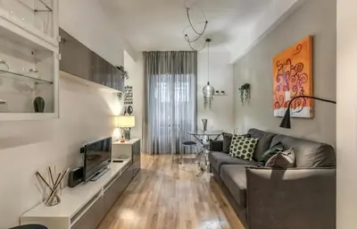 a living room with a couch and a table at FRAM Vatican Apartment in Rome