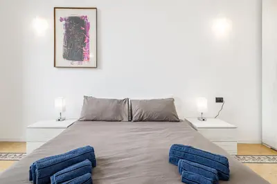 a bedroom with a large bed with two night stands at Vista Laterana in Rome