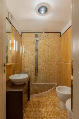 a bathroom with a tub and a sink and a shower at Celeste Retreat al Pantheon - Homkeey Apartments in Rome