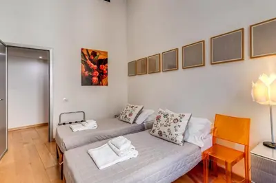 a living room with a couch and a table at Rosa Trastevere Magic Location in Rome