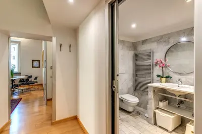 a bathroom with a sink and a toilet at Rosa Trastevere Magic Location in Rome