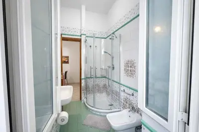 a bathroom with a shower and a sink and a toilet at -Colosseum 15 Min -Trastevere, Free Wi-Fi and A-C in Rome