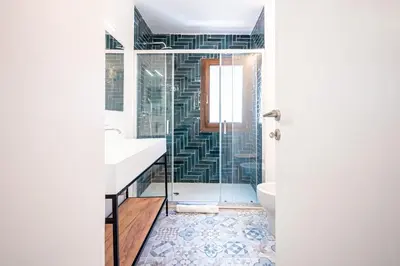 a bathroom with a shower and a sink and a toilet at Domus Piramide in Rome