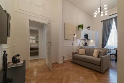 a living room with a couch and a table at Castro Pretorio 21 - FromHometoRome in Rome