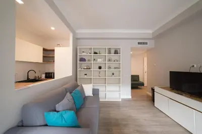 a living room with a couch and a television at VaticanRhome II in Rome
