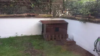 a brick box sitting next to a white wall at Bilocale EUR Grotta Perfetta 50mq casa 32mq sala hobbies e 250mq giardino in Rome