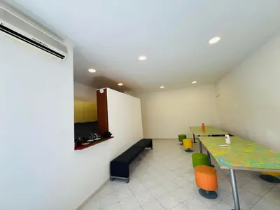 a room with a table and a bench and a table and chairs at Trionfale Guest House in Rome