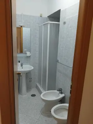 a bathroom with a toilet and a sink at Trionfale Guest House in Rome