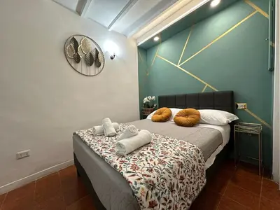 a bedroom with a bed with two pillows on it at incanto e campo de fiori in Rome