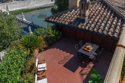 an overhead view of a patio with a table and chairs at The Perfect View- Angel's Castle' in Rome