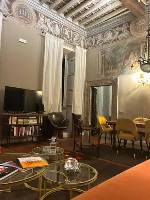 a living room filled with furniture and a tv at La Casa d'Argento in Rome