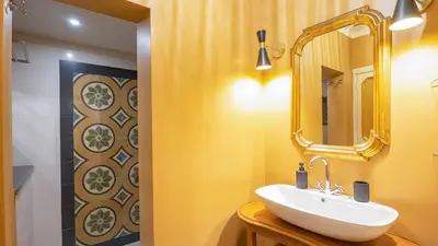 a bathroom with a sink and a mirror at La Casa d'Argento in Rome