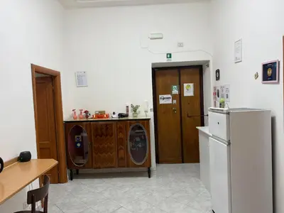 a kitchen with a washing machine and a refrigerator at Roma Belvedere Termini in Rome
