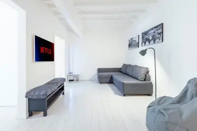 a living room with a couch and a chair at Maison Parlamento - Roma centro in Rome