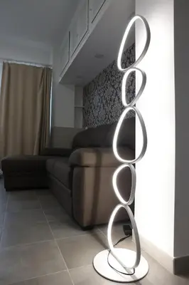 a metal sculpture in a living room with a couch at Sweet Home Fleming in Rome