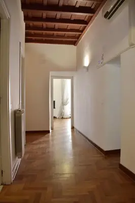 an empty room with a wooden ceiling at Apartment in Campo de' Fiori in Rome