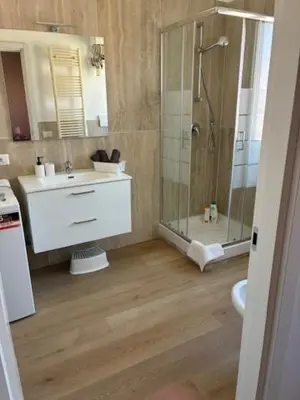 a bathroom with a shower and a sink and a toilet at Mila house suite in Rome